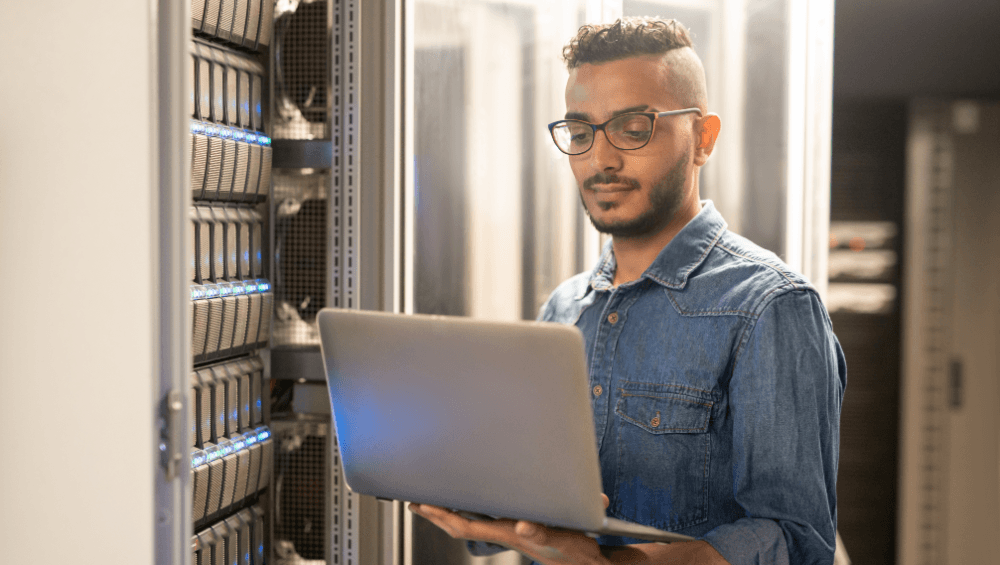 A man using a laptop for process mining